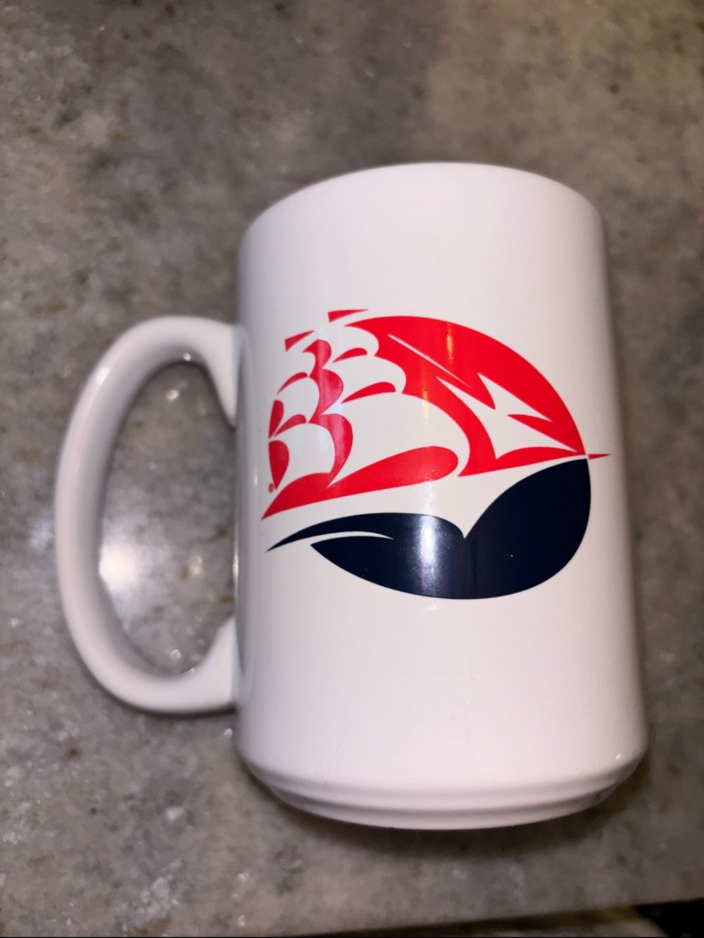 Shippensburg White Ceramic Mug with Red Navy Ship Wave Graphic